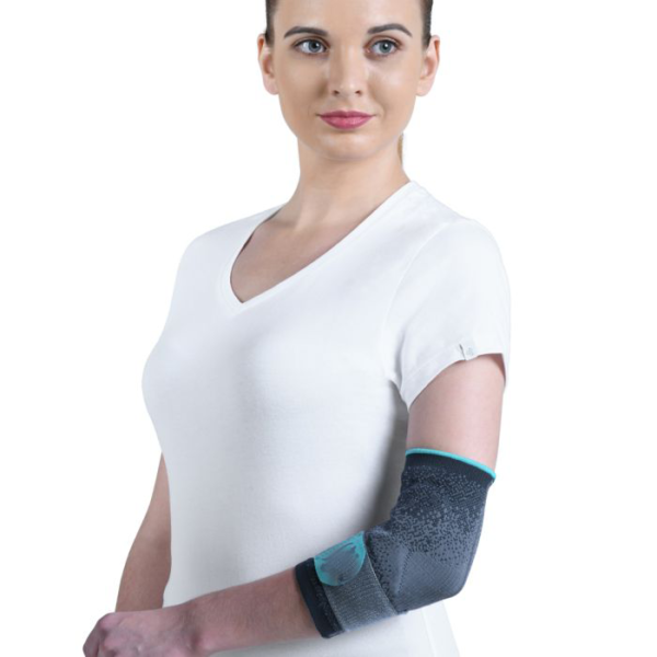 An elbow support with silicon inserts and a forearm strap, designed by Figure Fine to provide firm compression, support, and warmth to the elbow joint and forearm.